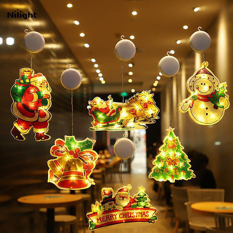 Outdoor lighted Christmas-themed ornaments