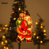 Outdoor lighted Christmas-themed ornaments
